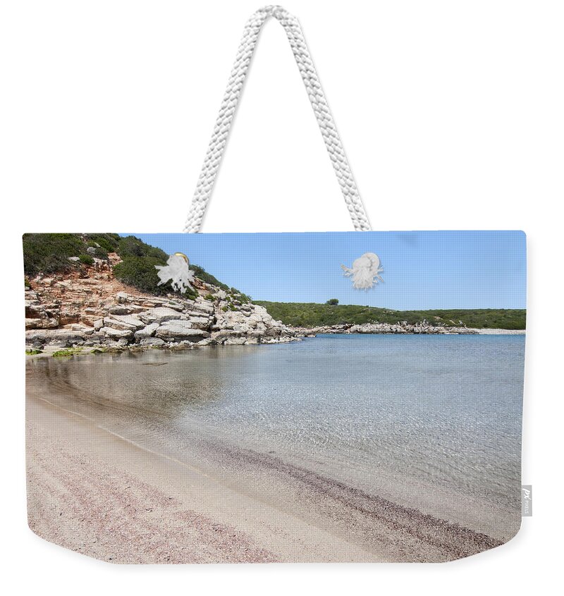 Blue Weekender Tote Bag featuring the photograph Red Sand of Cala Pudent in Menorca offers crystal water and amazing blue sky by Pedro Cardona Llambias