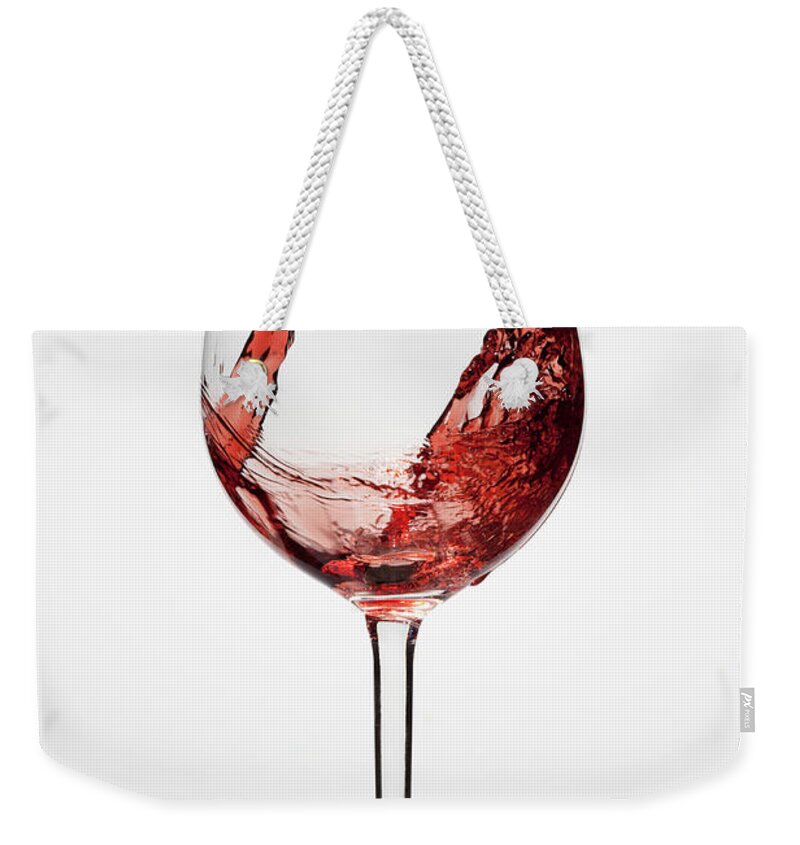 Alcohol Weekender Tote Bag featuring the photograph Red Wine Being Poured Into A Glass by Dual Dual