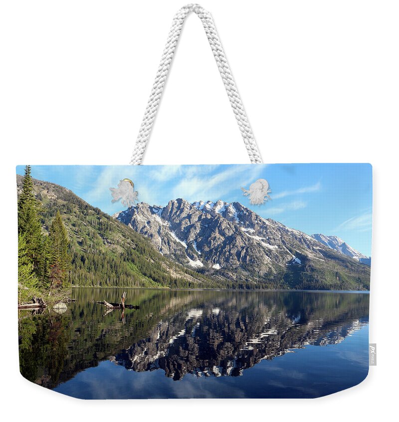 Lake Weekender Tote Bag featuring the photograph Reflections in the South end of Jenny Lake by George Jones