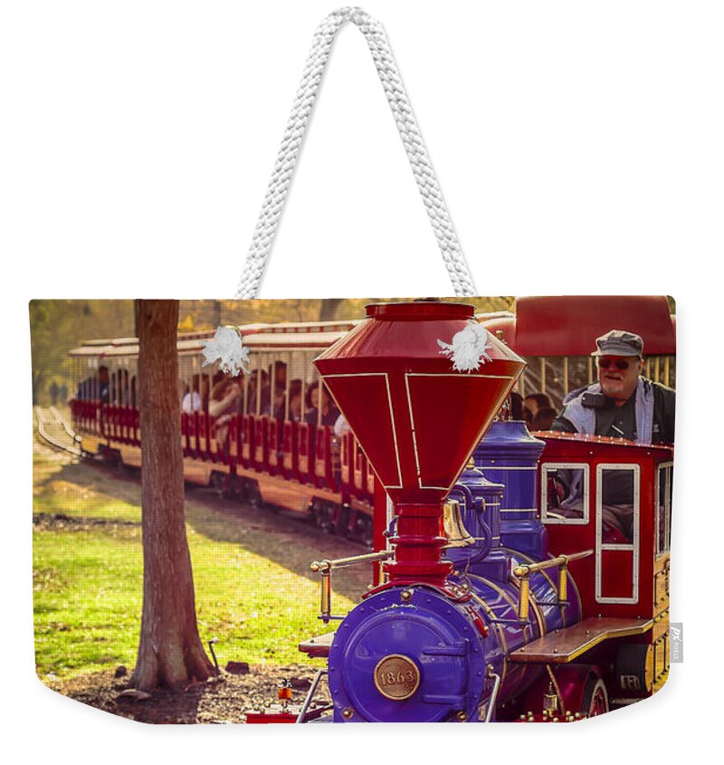 Train Weekender Tote Bag featuring the photograph Riding out of the Sunset on the Hermann Park Train by David Morefield