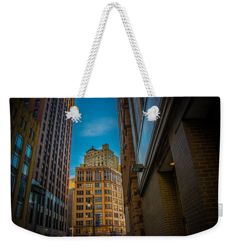 Detroit Weekender Tote Bag featuring the photograph Rising Above by Pravin Sitaraman