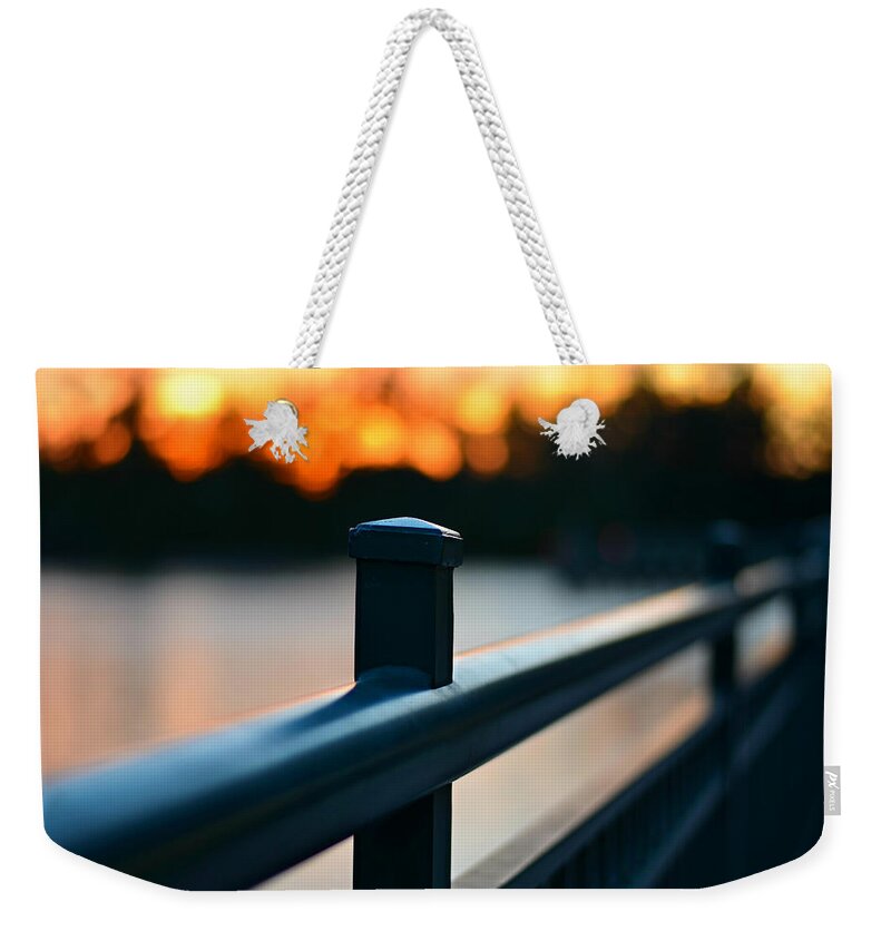 Sunset Weekender Tote Bag featuring the photograph Fiery Sunset Bridge by Laura Fasulo