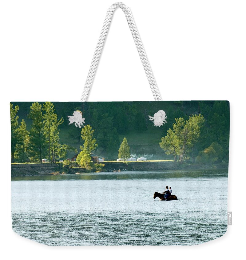 Adventure Weekender Tote Bag featuring the photograph River Crossing On Horse, Mongolia by Ted Wood