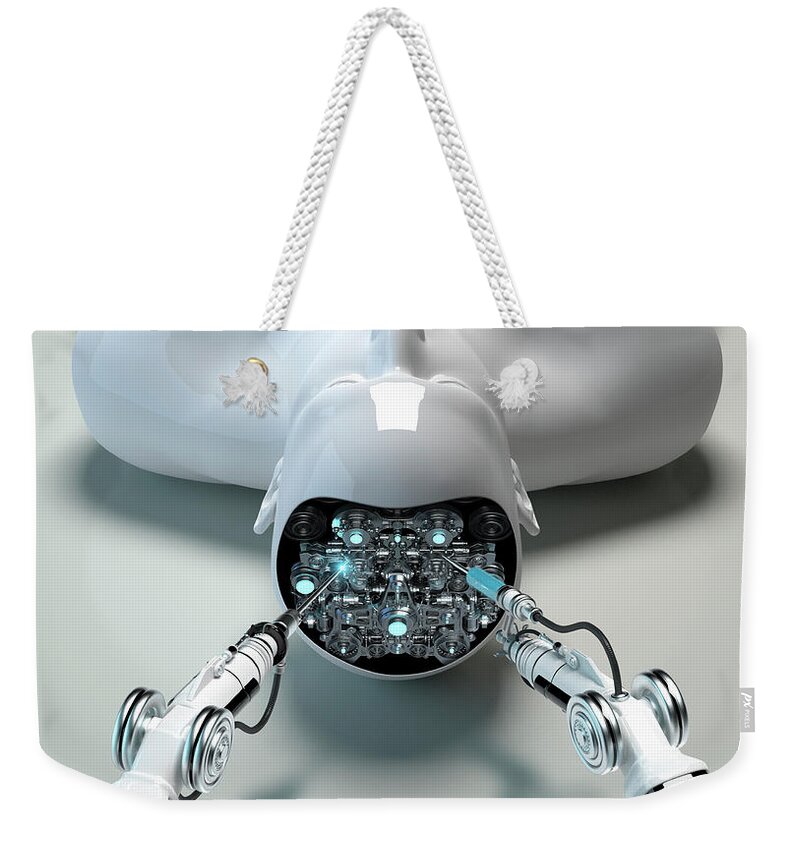 Accuracy Weekender Tote Bag featuring the photograph Robotic Arm Repairing Brain Of Male by Ikon Ikon Images