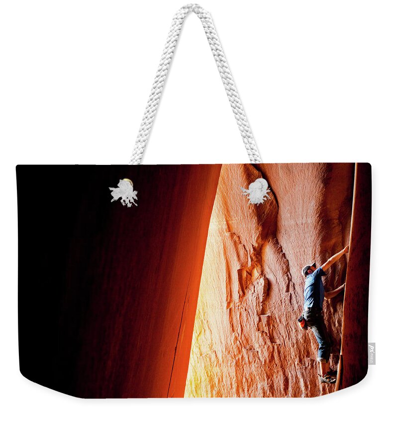Recreational Pursuit Weekender Tote Bag featuring the photograph Rock Climbing In Utah At Indian Creek by Epicurean