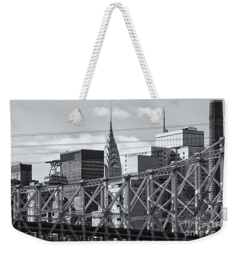 Clarence Holmes Weekender Tote Bag featuring the photograph Roosevelt Island Tram and Manhattan Skyline II by Clarence Holmes