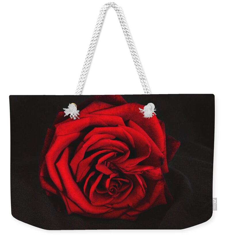 Rose Weekender Tote Bag featuring the photograph Red Rose on black by Tom Conway