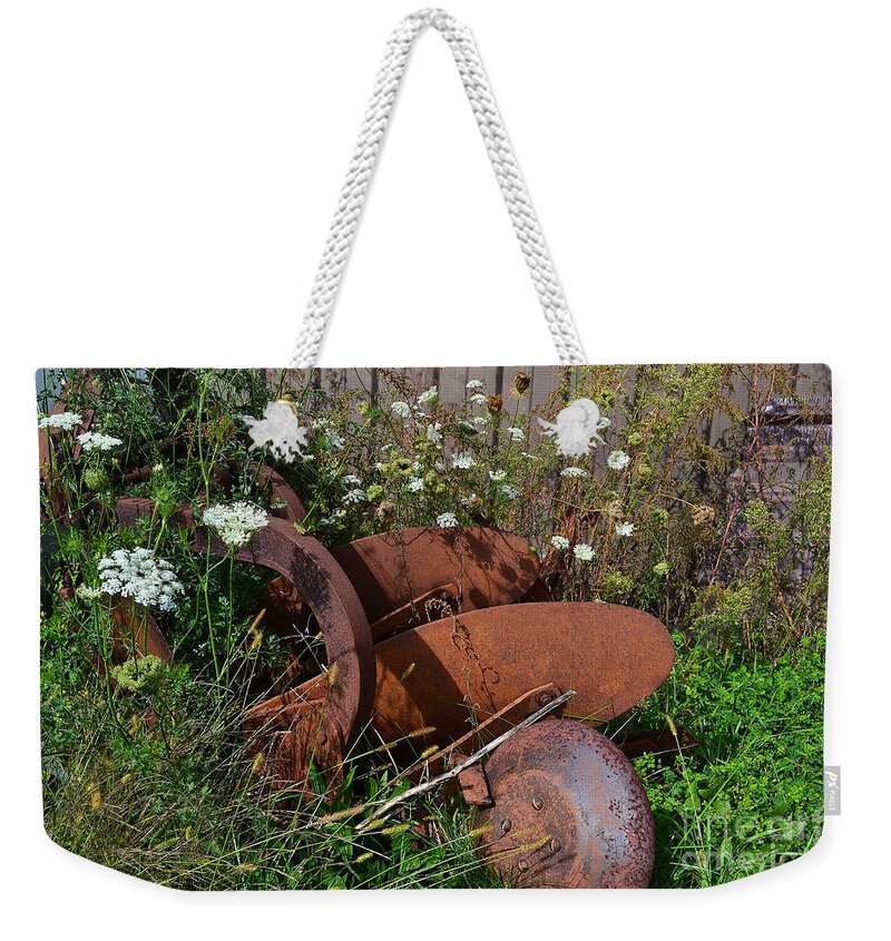 Farm Equipment Weekender Tote Bag featuring the photograph Rustic Farm Equipment Flowers by Amy Lucid