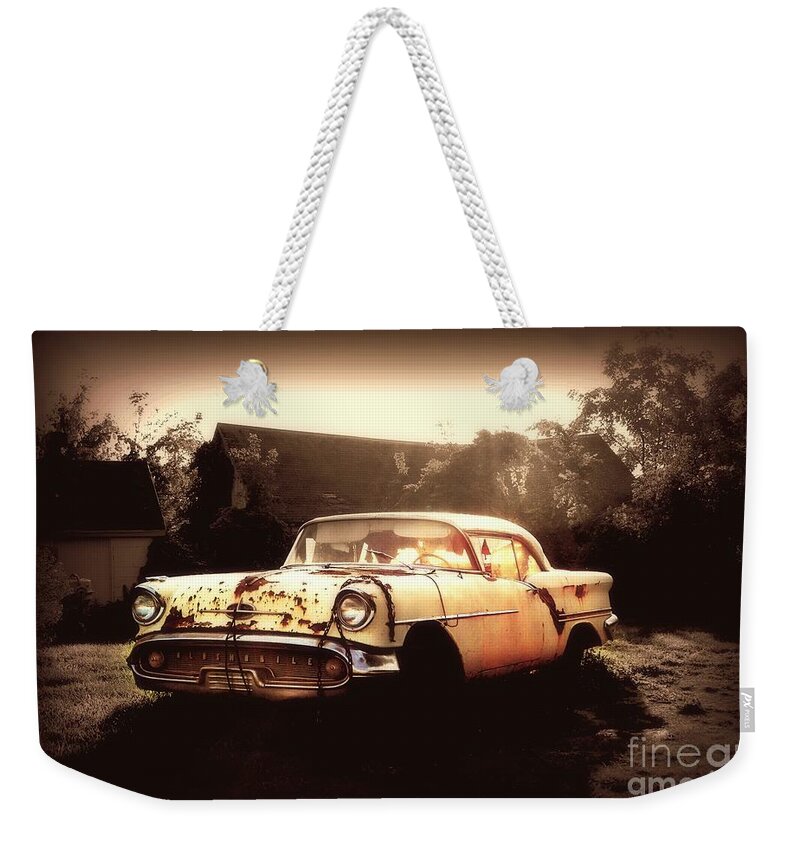 Oldsmobile Weekender Tote Bag featuring the photograph Rusty Oldsmobile by Beth Ferris Sale