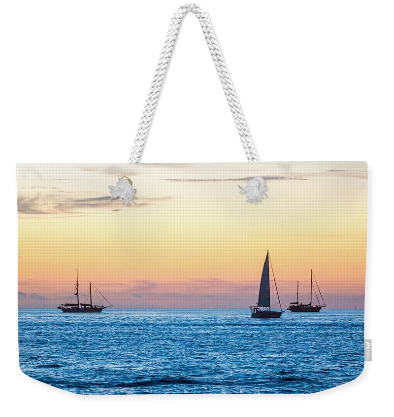 Key West Weekender Tote Bag featuring the photograph Sailboats at Sunset off Key West Florida by Photographic Arts And Design Studio