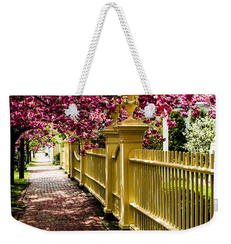 Salem Weekender Tote Bag featuring the photograph Salem walkway shrouded by spring flowers by Jeff Folger