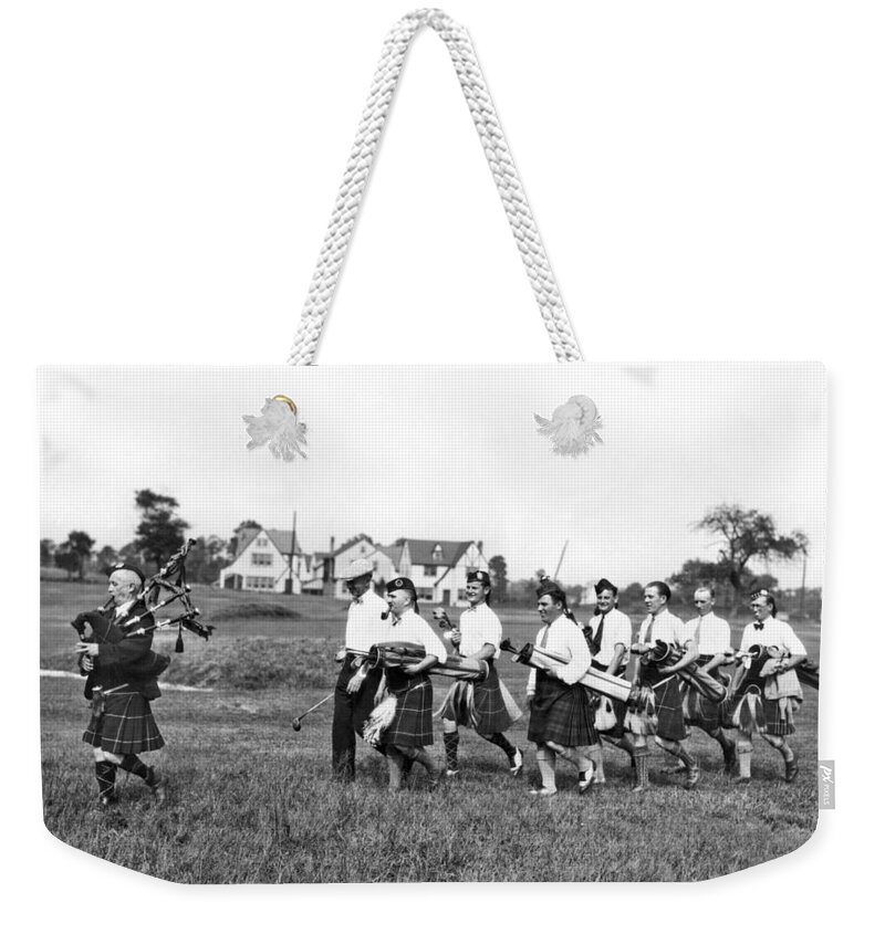 1920s Weekender Tote Bag featuring the photograph Scottish Golfers With Bagpipe by Underwood Archives