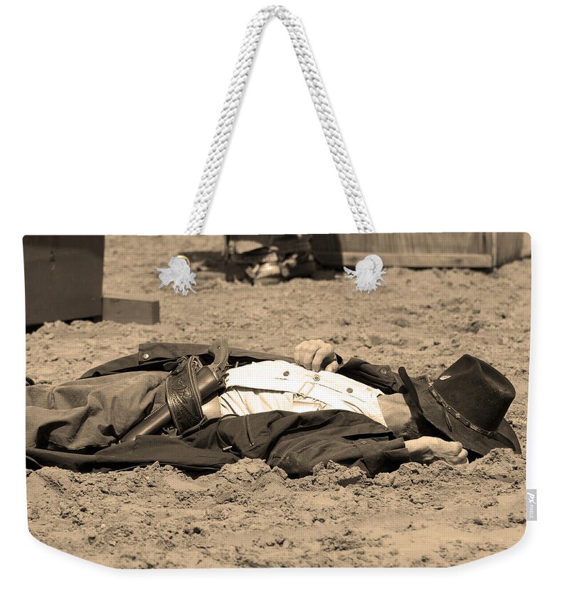 Sepia Weekender Tote Bag featuring the photograph Sepia Rodeo Gunslinger Victim by Sally Rockefeller