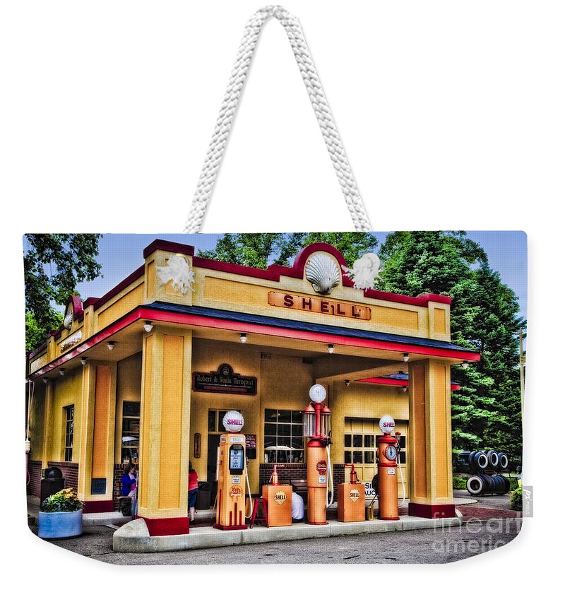 Automobiles Weekender Tote Bag featuring the photograph Shell Station by Timothy Hacker
