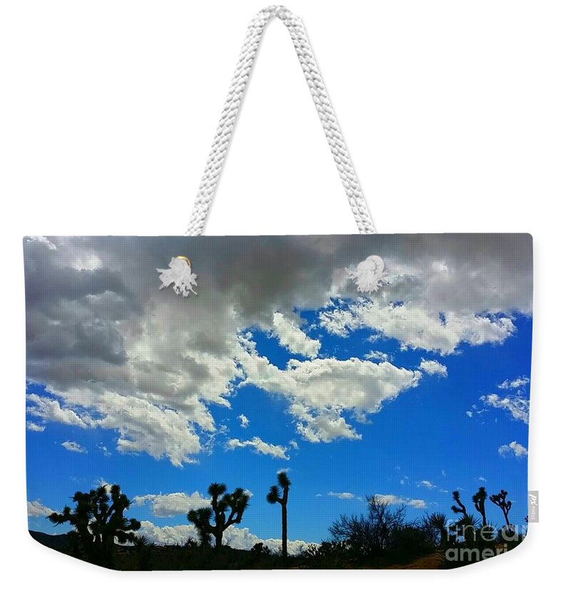 White Clouds Weekender Tote Bag featuring the photograph Silhouettes by Angela J Wright