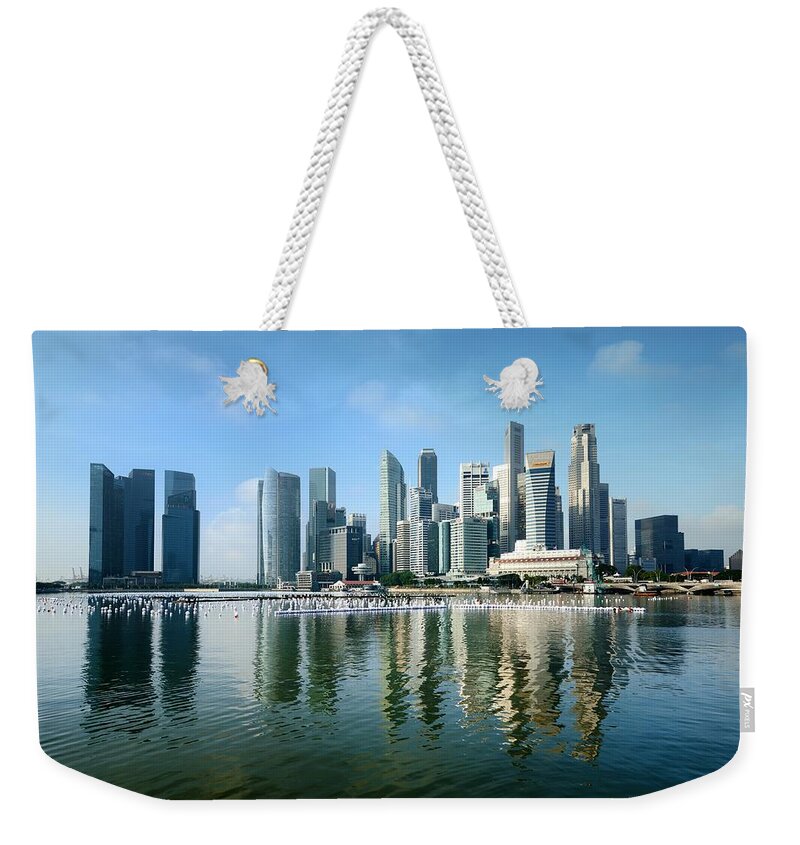 Built Structure Weekender Tote Bag featuring the photograph Singapore Skyline On A Blue Sunny Day by Carlina Teteris