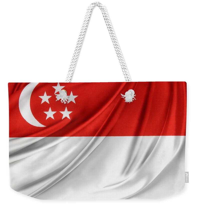 Banner Weekender Tote Bag featuring the photograph Singaporean flag by Les Cunliffe