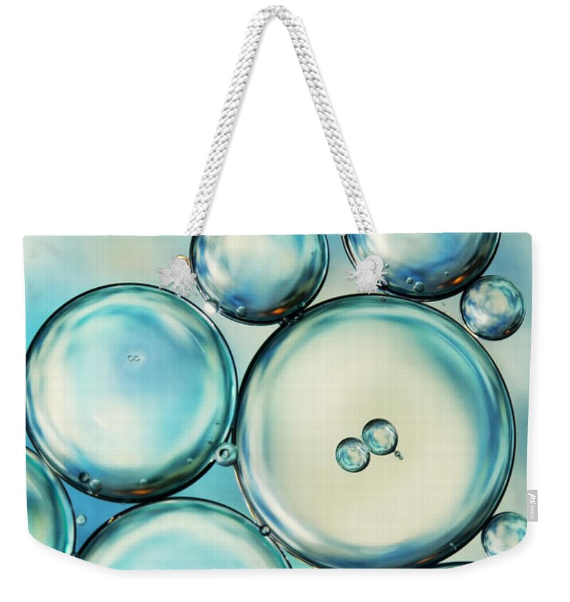 Oil Weekender Tote Bag featuring the photograph Sky Blue Bubble Abstract by Sharon Johnstone