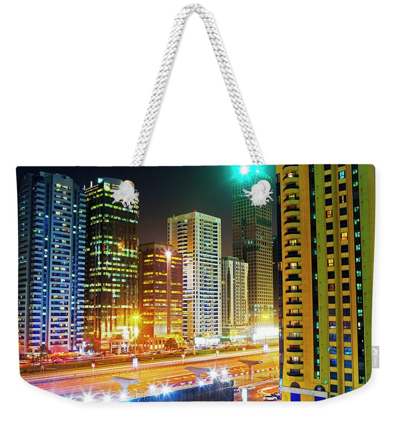 Tranquility Weekender Tote Bag featuring the photograph Skyscrapers On Sheikh Zayed Road, Night by Scott E Barbour