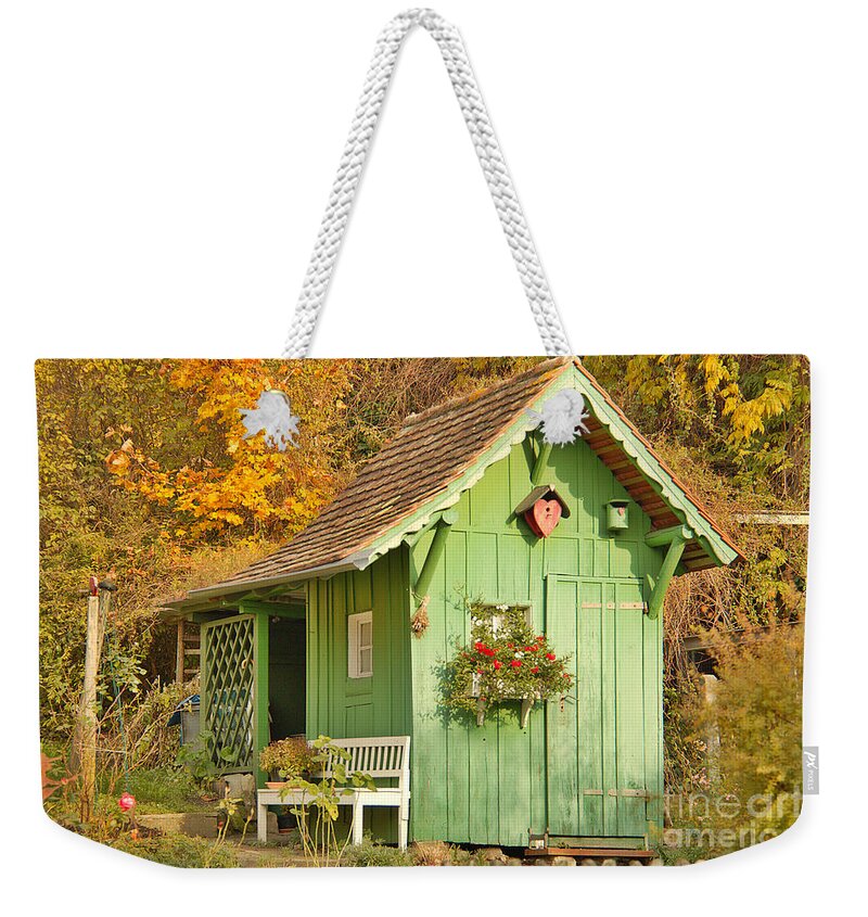 Architecture Weekender Tote Bag featuring the photograph Small garden House by Amanda Mohler