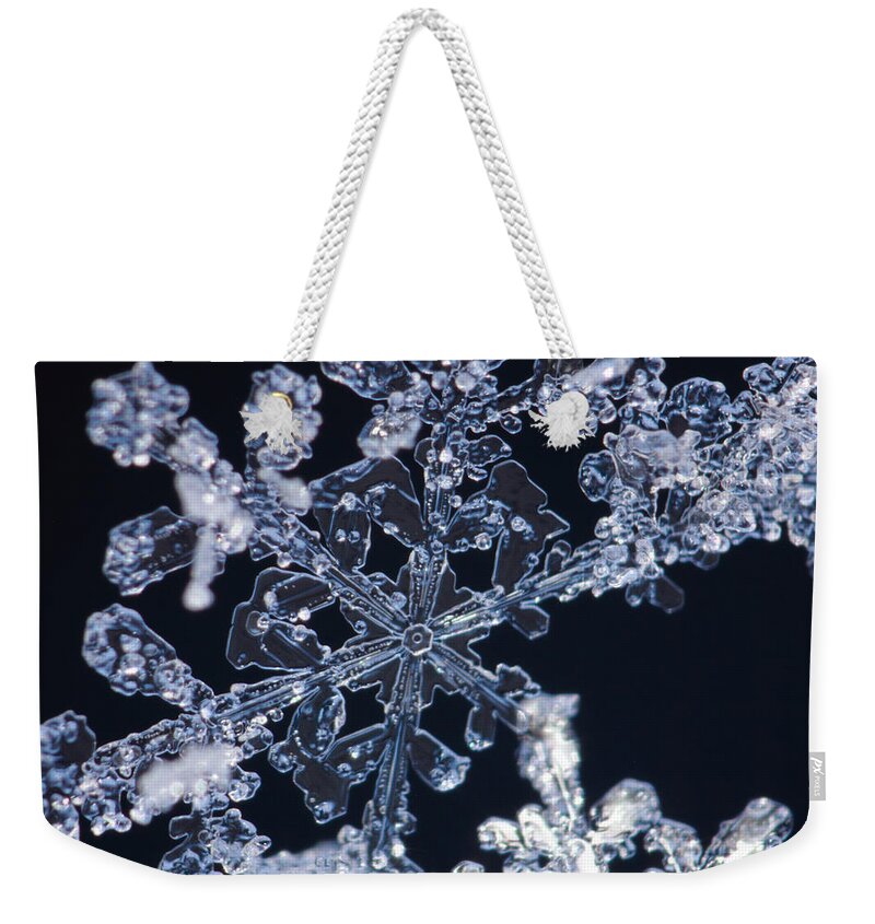 Black Weekender Tote Bag featuring the photograph Snowflake blue and black by Ulrich Kunst And Bettina Scheidulin