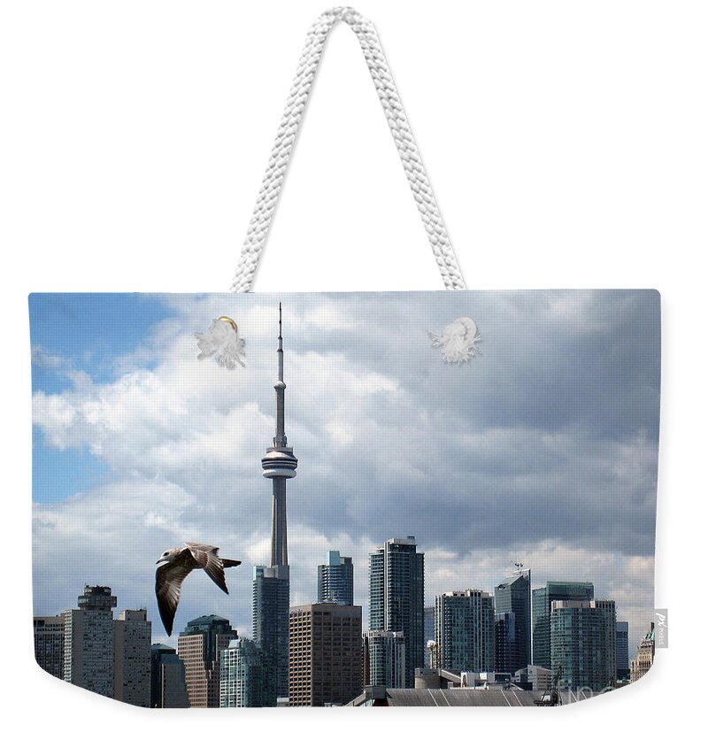 Toronto Weekender Tote Bag featuring the photograph Soaring Over the Harbour by Nina Silver