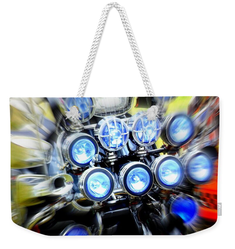 Scooter Weekender Tote Bag featuring the photograph Spotlight Frenzy by Steve Kearns