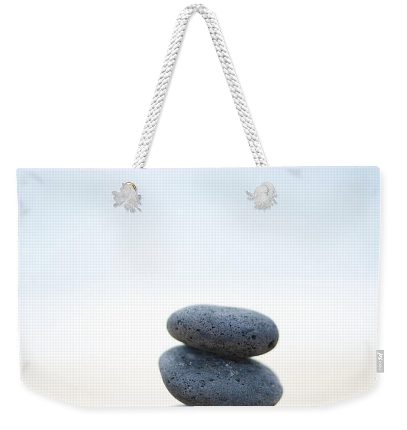 Balance Weekender Tote Bag featuring the photograph Stack of Stones on Sand by M Swiet Productions