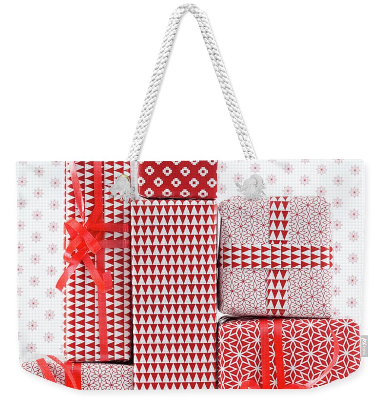 Copenhagen Weekender Tote Bag featuring the photograph Stack Of Wapped Gifts by Muriel De Seze