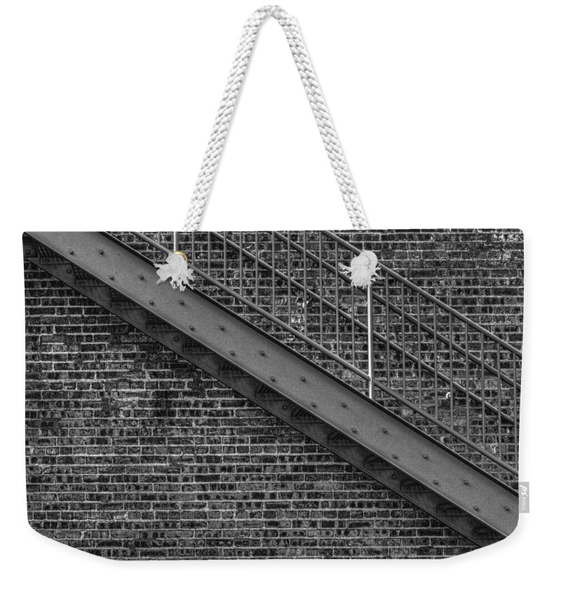 Architectural Detail Weekender Tote Bag featuring the photograph Stairs by Roger Passman