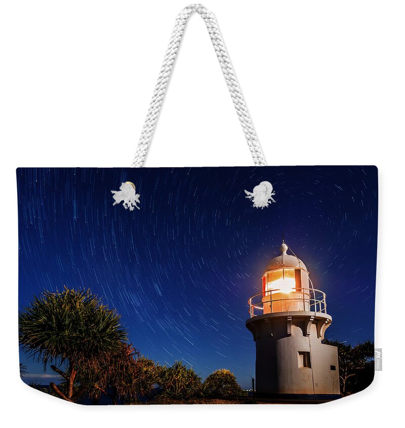 Tranquility Weekender Tote Bag featuring the photograph Star Swirl Over Fingal Lighthouse by Photography By Byron Tanaphol Prukston