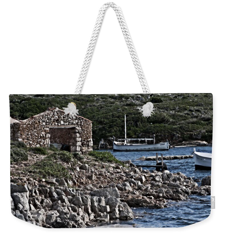 Beauty Weekender Tote Bag featuring the photograph Roman port of Sa Nitja in Minorca - Stone and sea by Pedro Cardona Llambias