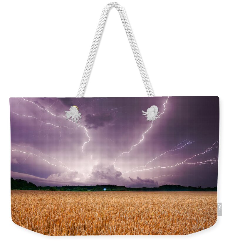 Lightning Weekender Tote Bag featuring the photograph Storm over wheat by Alexey Stiop