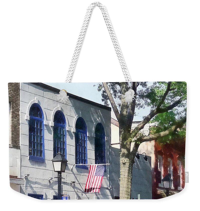 Alexandria Weekender Tote Bag featuring the photograph Alexandria VA - Street With American Flag by Susan Savad