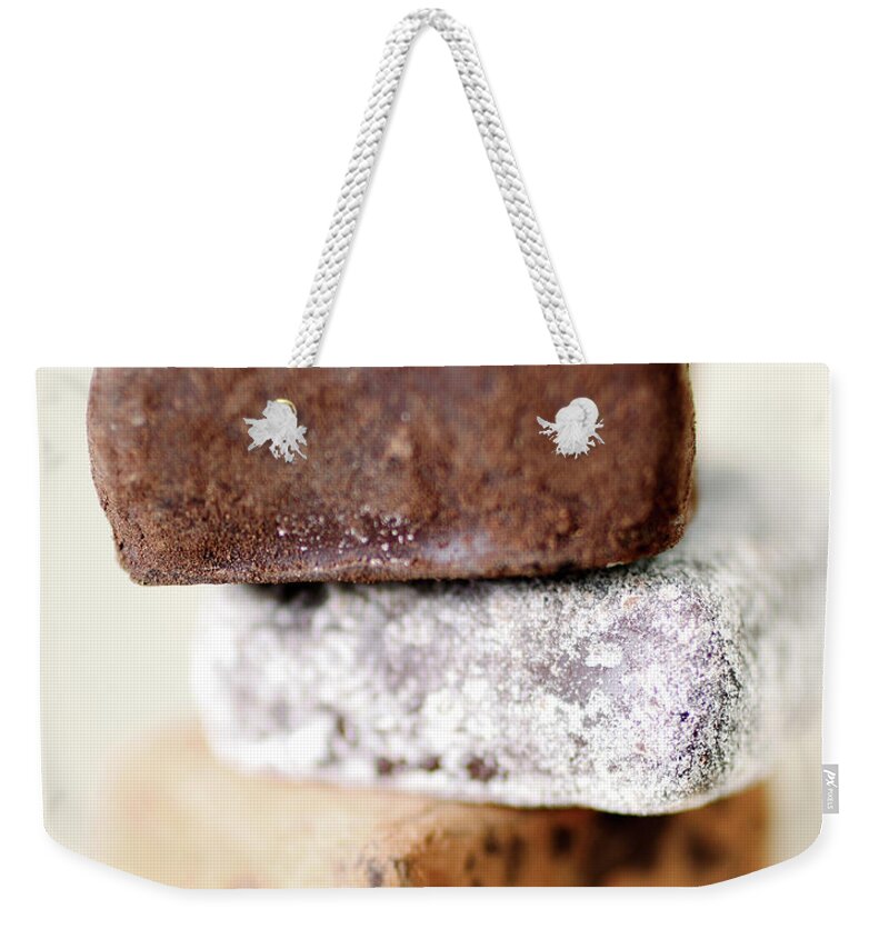 White Background Weekender Tote Bag featuring the photograph Studio Shot Of Truffle Candies by Johner Images