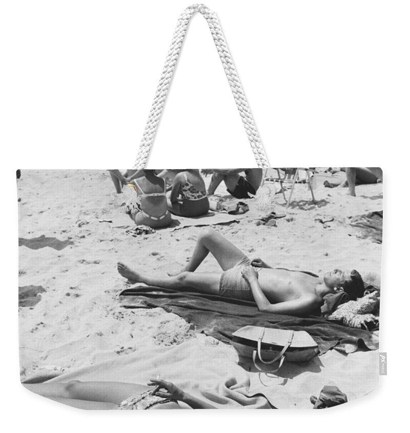 History Weekender Tote Bag featuring the photograph Sunbathers, 1963 by Suzanne Szasz