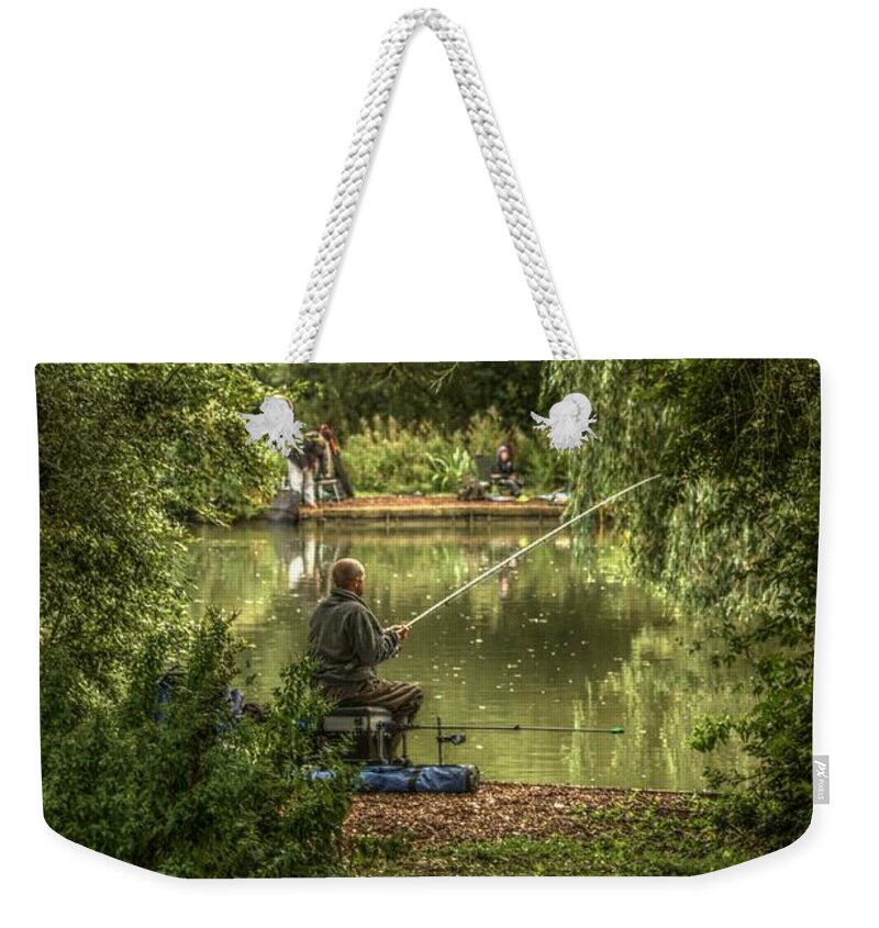 Sunday Fishing Weekender Tote Bag featuring the photograph Sunday fishing at the Lake by Jeremy Hayden