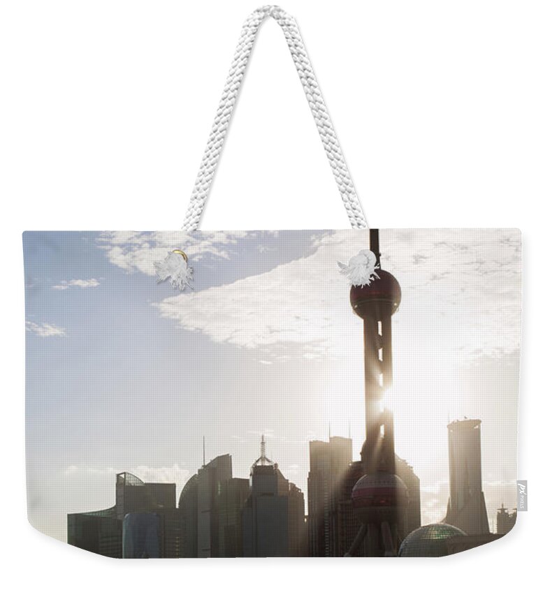 Tranquility Weekender Tote Bag featuring the photograph Sunlight Over Shanghai Buildings Of by Matteo Colombo