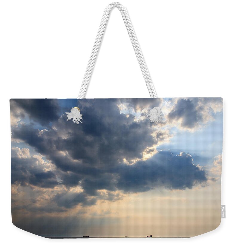Trieste Weekender Tote Bag featuring the photograph Sunrays scattered by clouds over Trieste Bay by Ian Middleton