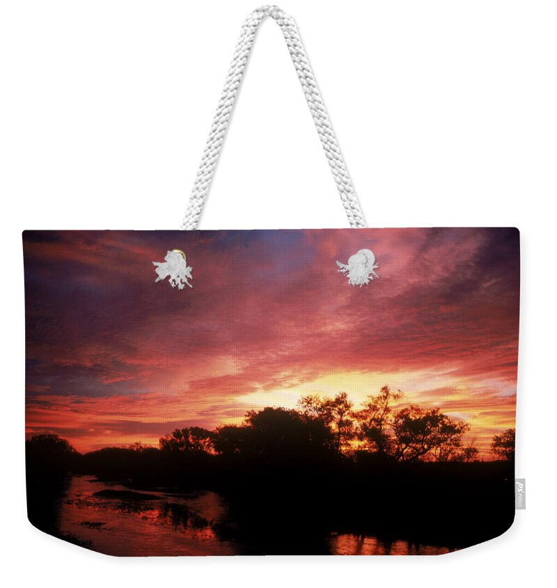 Astronomy Weekender Tote Bag featuring the photograph Sunrise by Dan Guravich