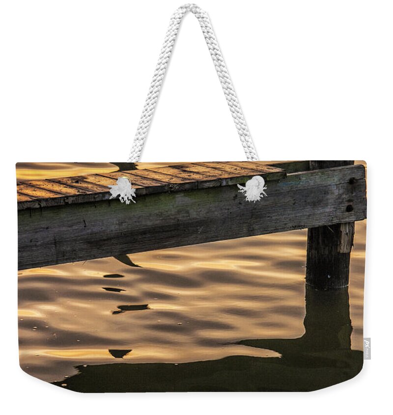 Reflections Weekender Tote Bag featuring the photograph Sunrise Reflections on the Water by a Boat Dock by Randall Nyhof