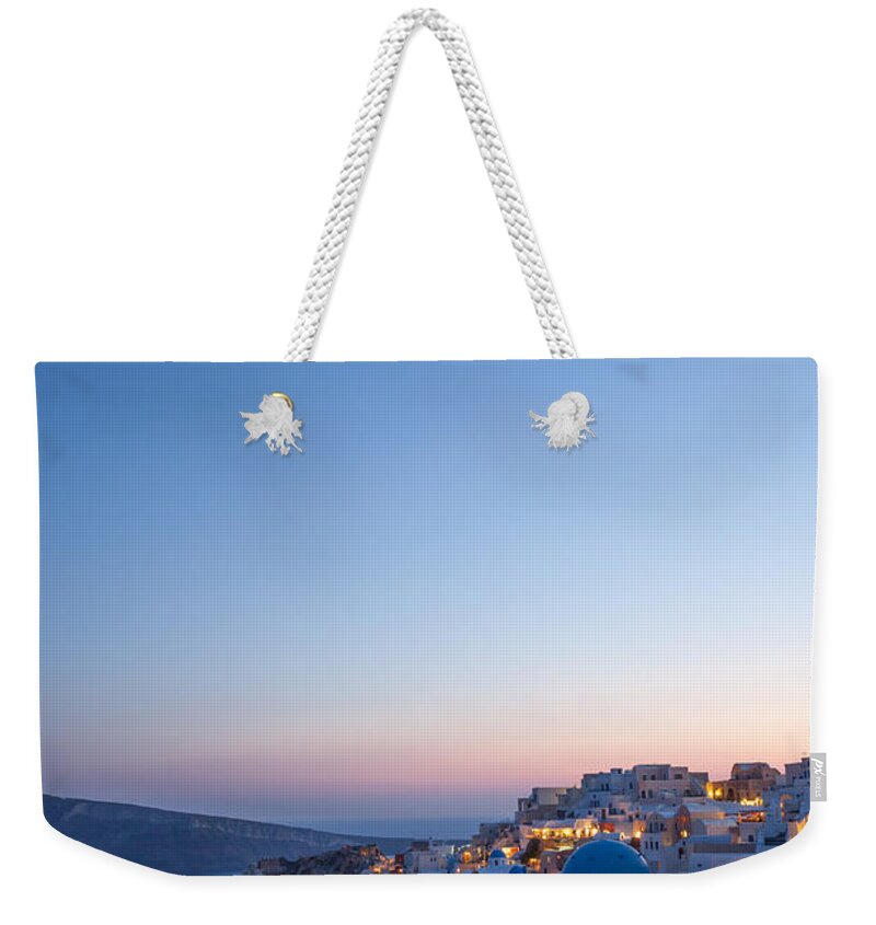 Santorini Weekender Tote Bag featuring the photograph Sunset and moon over Oia - Santorini - Greece by Matteo Colombo