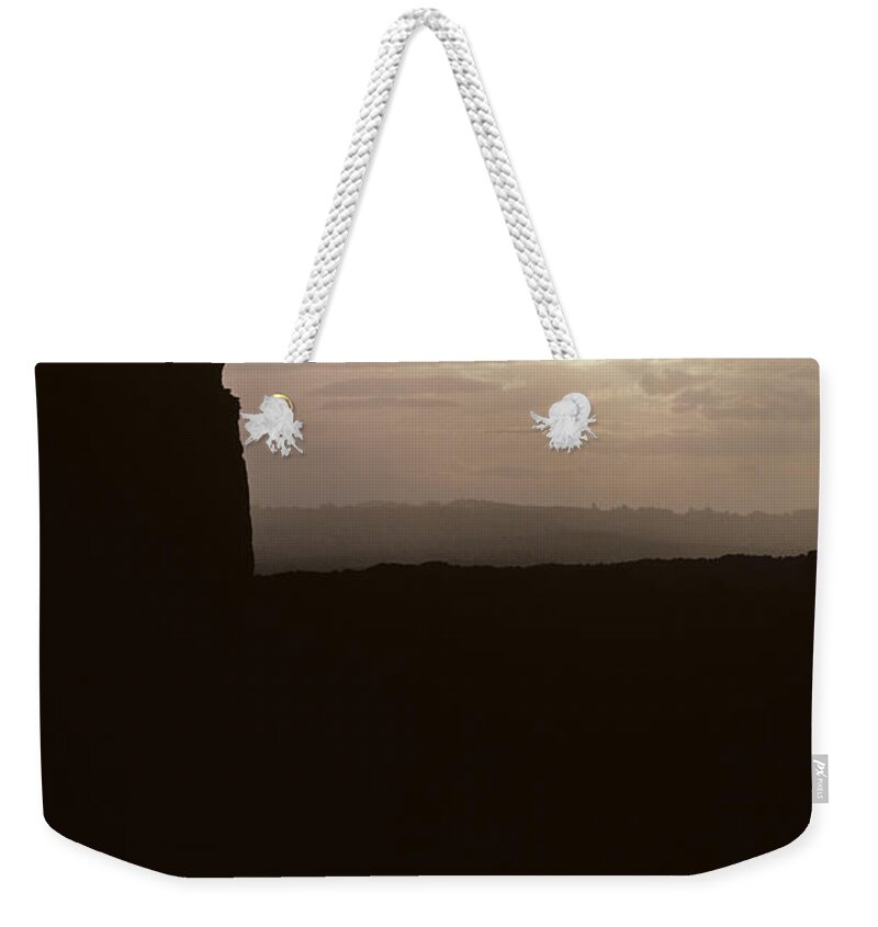 Landscape Weekender Tote Bag featuring the photograph Sunset Arches National Park with silhouetted man on ridge with s by Jim Corwin