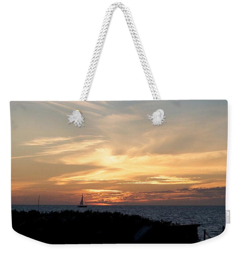 Sunset And Sailboat Weekender Tote Bag featuring the photograph Sunset at the Beach by Kristin Hatt