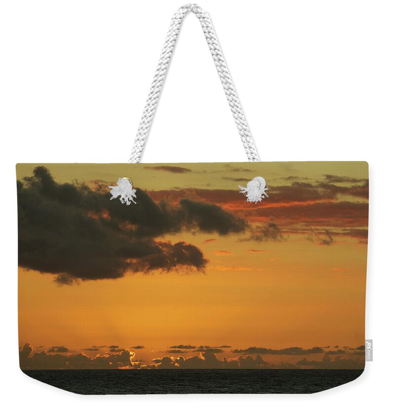Scenics Weekender Tote Bag featuring the photograph Sunset Over The Indian Ocean by Owen Franken