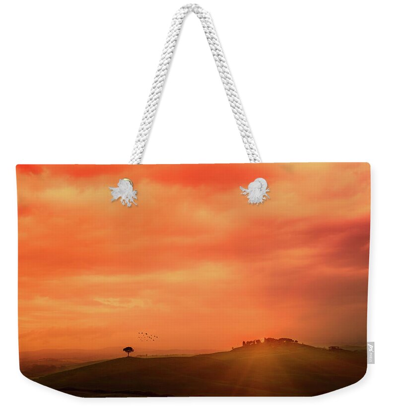 Orange Color Weekender Tote Bag featuring the photograph Sunset Over The Tuscan Hills by Deimagine