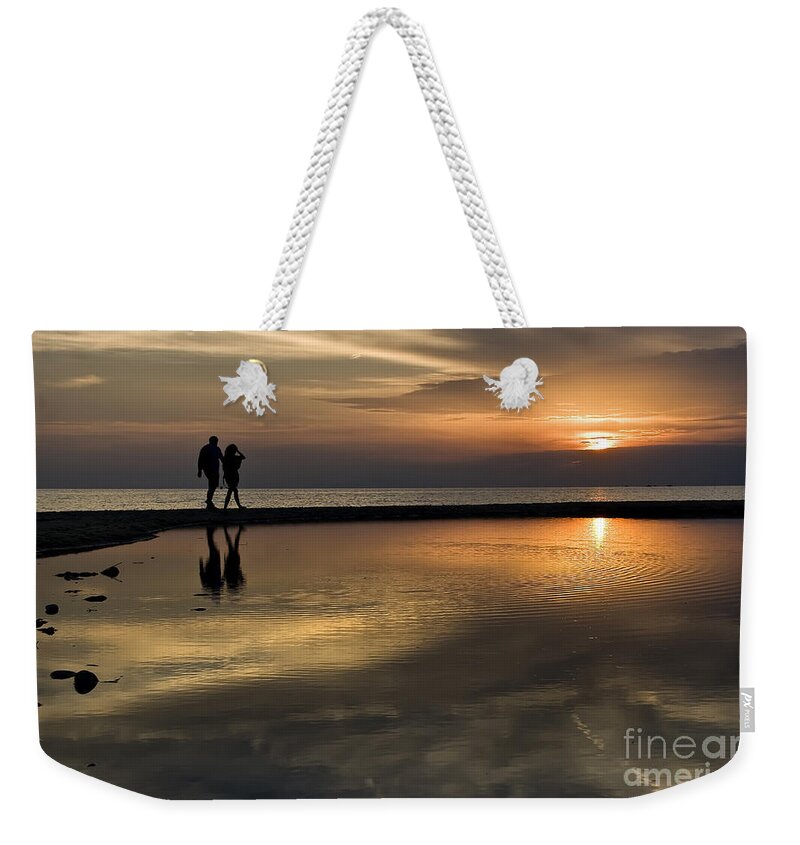 Sunset Weekender Tote Bag featuring the photograph Sunset reflection and silhouettes by Daliana Pacuraru