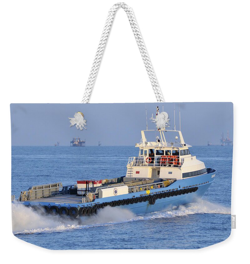 Supply Vessel Weekender Tote Bag featuring the photograph Supply Vessel heads to sea by Bradford Martin