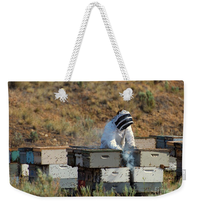 Beekeeper Weekender Tote Bag featuring the photograph Swarmed by Michael Dawson