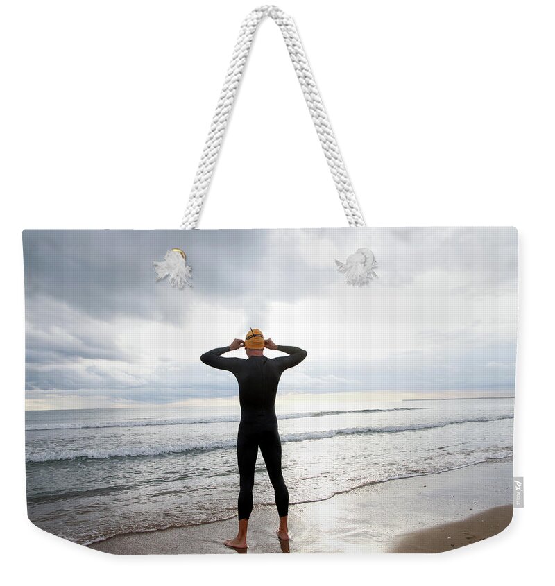 Hands Behind Head Weekender Tote Bag featuring the photograph Swimmer On The Beach by (c) Jaime Monfort